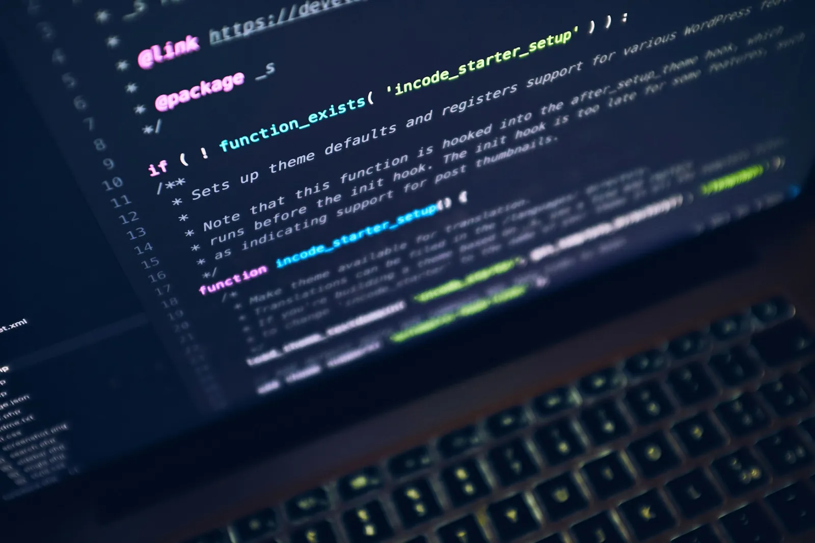 Lines of code on a laptop screen in blue light
